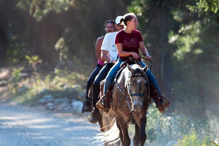 Three people riding horses | North Cascades Lodge at Stehekin