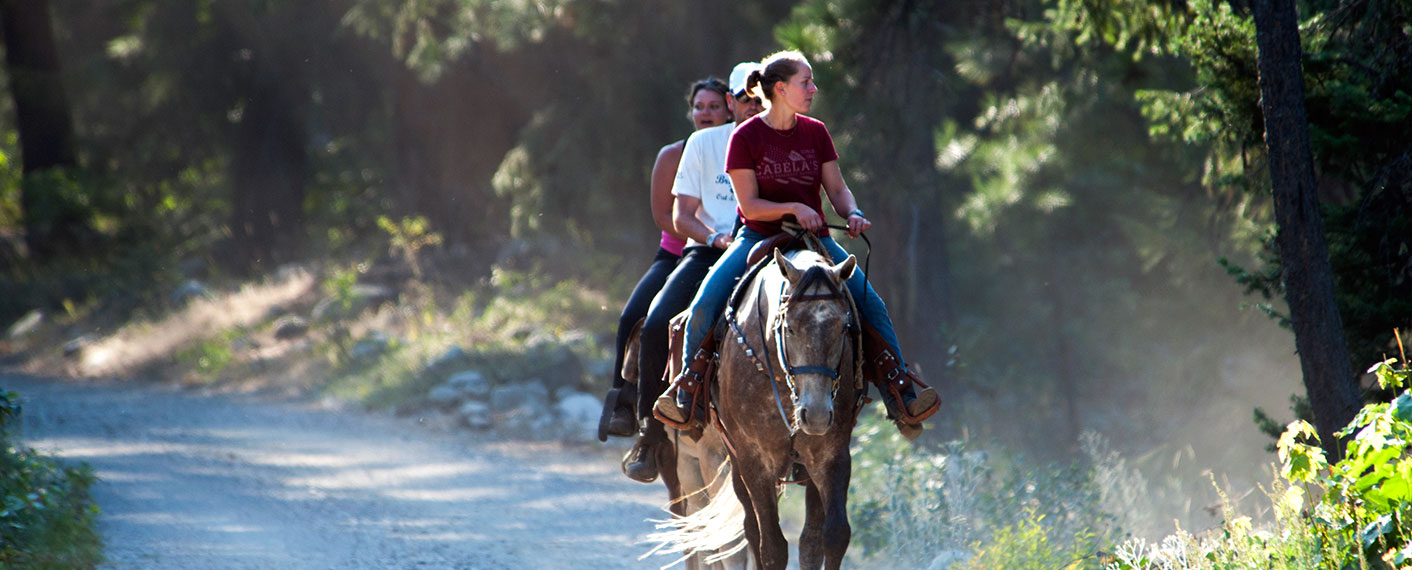 Three people riding horses | North Cascades Lodge at Stehekin
